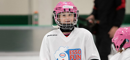 Image of girl playing hockey.