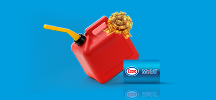 Red gasoline jerry can with a yellow bow on it appears on a blue background with an Esso/Mobil fuel card in front.
