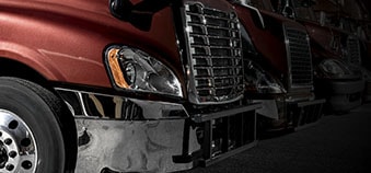 Multiple fleet trucks parked