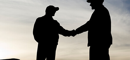 a trucker shaking hands with someone