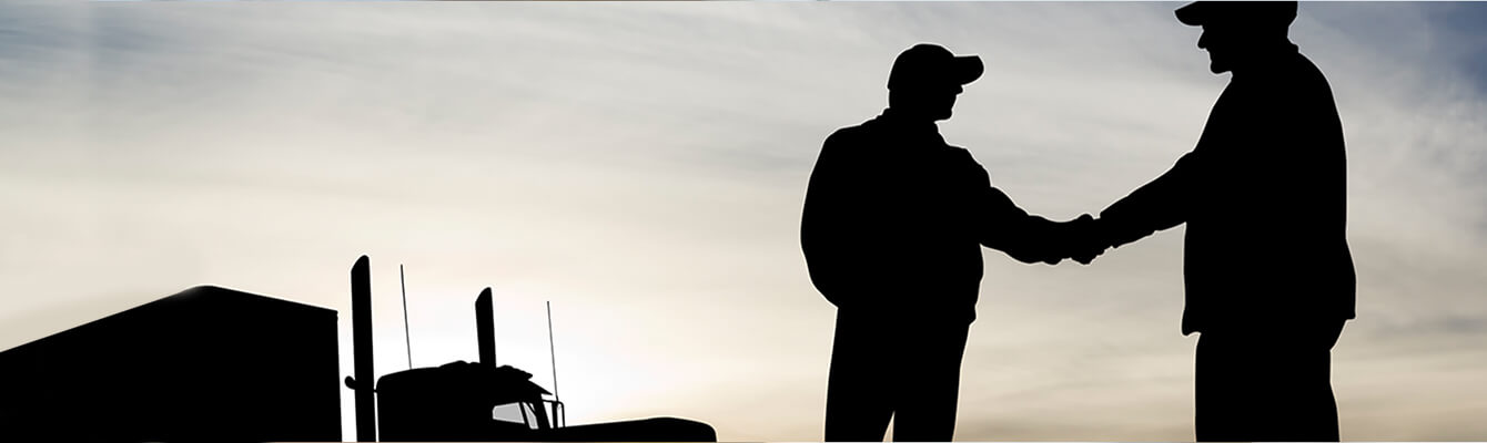 a trucker shaking hands with someone