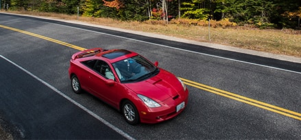 Red personal vehicle on the road